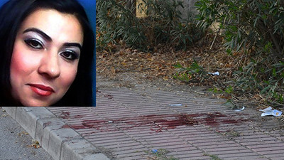 Karısını boğazından bıçaklayıp kaldırıma attı