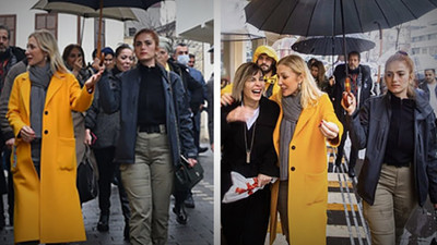 Bakan Ersoy'un eşi polise şemsiyesini tutturdu, 131 bin liralık çantasını taşıttı