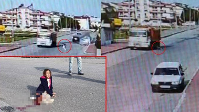 Sokak köpeklerinden kaçan küçük kız kamyonun altında kaldı: Güvenlik kamerası kaydetti