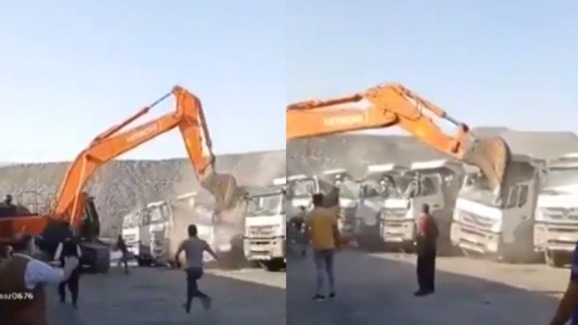 Parasını alamayan işçi, şirketin kamyonlarını kepçeyle parçaladı
